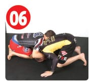 Next, Garry snaps his opponent down to the mat. He doesn’t go straight back, instead he snaps him down to his left, the side opposite his opponent’s head.  This puts the most amount of pressure on his opponent.