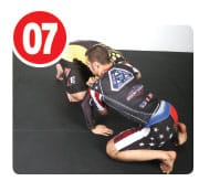 When his opponent hits the mat he’s forced to at least post  with one hand to the mat or else he’s going to smash his head. When he does this it opens up the opportunity for the guillotine.