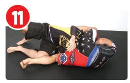 A common way to defend this choke is for the opponent to fall to the side with Garry when he goes for the finish, this is what Kit Dale did at M4. To prevent that, Garry keeps his left leg posted out until just before he goes for the rotation. As he begins to rotate, he quickly brings his left heel up and over to his opponent’s back. Bringing the leg over helps Garry to go with his opponent and keep the choke, even if he falls all the way to his back.