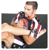 A. Garry picks the right ankle to attack and gets an overhook with his left arm holding it tight between his arm and body up near the armpit.